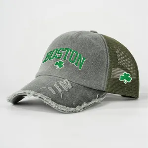 Distressed grey trucker hat with green Boston embroidery and shamrock patches for men and women.