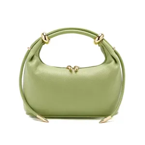 Light green leather handbag for women, stylish shoulder bag with metal accents and drawstring.
