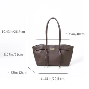 Retro brown trapezoid tote bag with wing design, elegant leather shoulder bag with clear size specs.