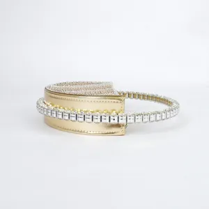 Close-up detail of the luxury gold rhinestone semi-circular evening handbag sparkle design.