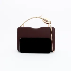 Elegant wine red evening clutch bag featuring a unique gold tulip metal handle and chain strap.