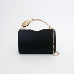 Black evening clutch bag with gold tulip metal handle and chain strap for women detail view.