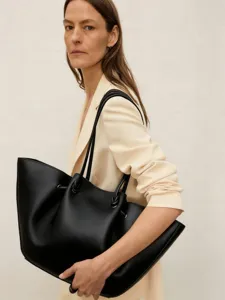 Large capacity slouchy leather tote bag for women, stylish commuter shoulder bag.