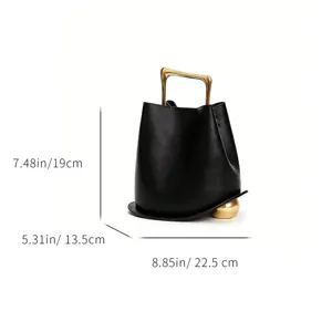 Black leather bucket bag detail with gold handle and dimension specs 8.85x7.48 inches
