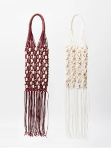 Handmade woven wax rope beaded hollow tassel handbag detail shot, boho beach style women bag.