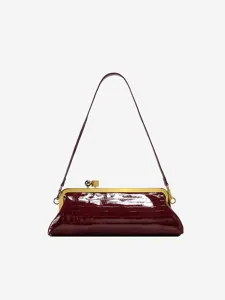 Detailed view of luxury burgundy alligator embossed shoulder bag with gold hardware and clasp.