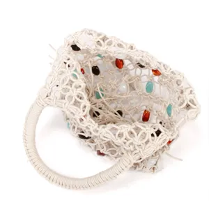 Detailed close-up of handmade woven mesh handbag with colorful beads and round handle.