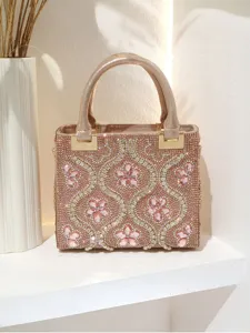 Sparkling pink rhinestone evening handbag featuring intricate crystal flower patterns and shiny finish.