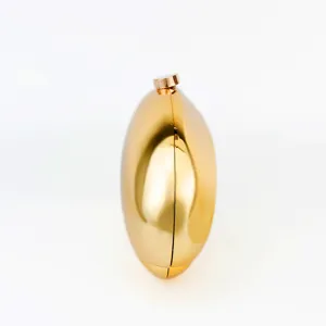 Gold metal acrylic clutch bag side detail view elegant evening purse compact minimalist style