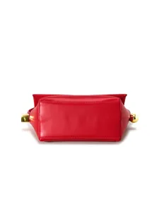 Red leather flap shoulder bag detail view, featuring unique gold-tone metal hardware.