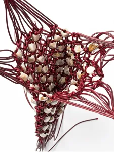 Handmade wax rope beaded woven hollow handbag detail view, bohemian vacation style.