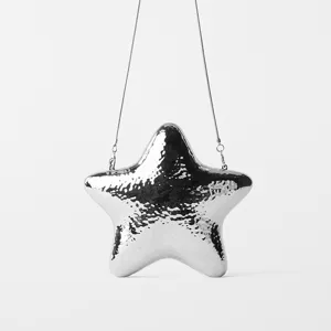 Detailed close-up view showing the shiny silver metallic star clutch surface and metal chain.