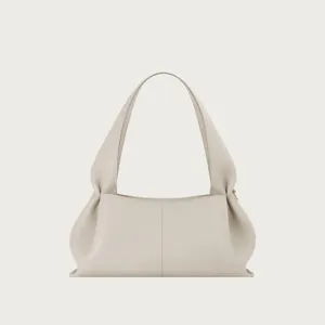 Detail view of the elegant light gray leather shoulder bag, featuring unique pleated design.