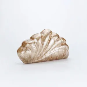 Detailed view of the elegant marble acrylic clutch bag with unique shell design.