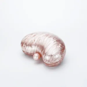 Pink marble acrylic bean clutch bag chic evening handbag elegant style detail view