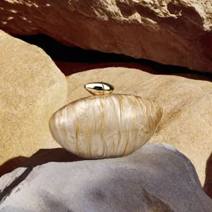 Elegant beige acrylic clutch bag with gold bullet clasp for women evening parties.