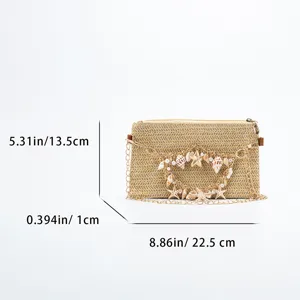 Woven straw shoulder bag with shell pearl charm casual summer beach crossbody handbag.
