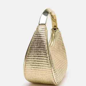 Exquisite metallic gold woven texture handbag with a sleek rigid metal handle and secure zipper.
