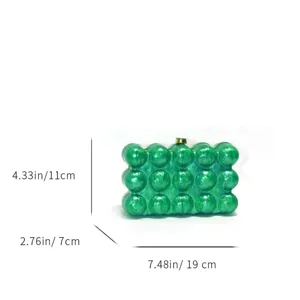 Green marble acrylic bubble detail of the fashion evening clutch bag with gold clasp.
