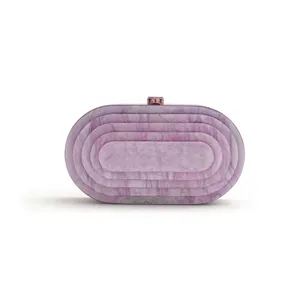 Purple marble acrylic detail of the oval evening clutch bag featuring a sleek metal top clasp.