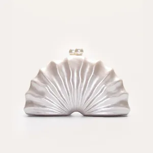 Pearl shell acrylic clutch detail view, elegant evening party handbag with pearl clasp closure.