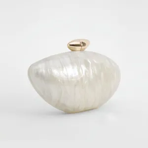 Elegant pearl white acrylic evening clutch bag featuring a sleek golden metal clasp for women.