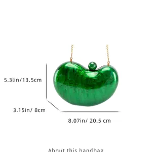 Green acrylic pea-shaped evening clutch bag with golden chain and clear dimensions for women fashion.