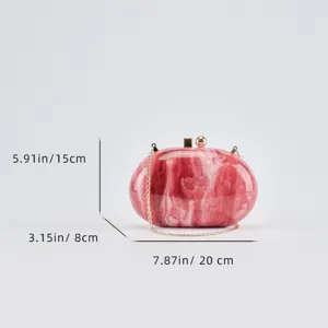Detail view of the red marbled acrylic evening clutch bag showing dimensions and chain.