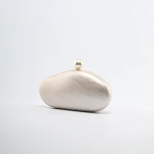 Acrylic cloud clutch bag with pearl clasp detail elegant evening purse for women detail view.