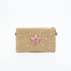 Stylish straw woven shoulder bag with pink starfish and pearls for summer casual daily commuting.