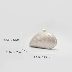 Acrylic seashell clutch bag detail view with elegant pearl clasp and compact portable size.
