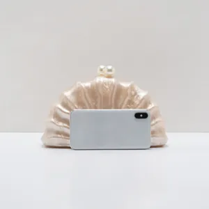 Acrylic shell clutch bag with pearl clasp, elegant evening party fashion minaudiere for women.
