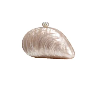Pearl clasp acrylic shell clutch bag for women, elegant evening party shoulder handbag main.