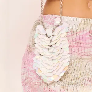 Iridescent sequin mini phone bag detail showcasing sparkling finish and silver chain