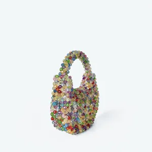 Colorful crystal beaded mini handbag detail, handmade shiny coin pouch handle accessory.