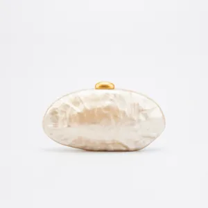 Acrylic clutch bag detail view, marble pattern surface, elegant gold metal clasp hardware.