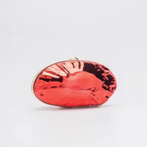 Glossy red acrylic lip shaped evening clutch bag with gold tone hardware for women weddings.