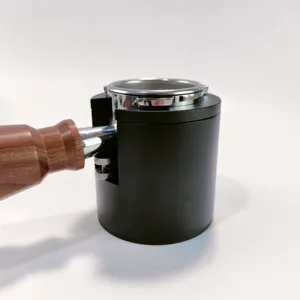 Coffee portafilter holder grind dosing funnel espresso tamping station detail view.