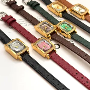 Luxury gold square quartz watch set with sparkling diamond bezel and leather straps.