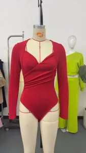 Detailed view of the red velvet crossover V-neck long sleeve bodysuit, slim fit design.