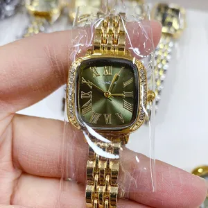 Gouden dameshorloge groene wijzerplaat romeinse cijfers strass bezel vintage horloge