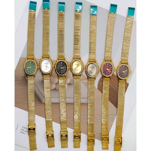 Vintage ovale Quarz Damenarmbanduhr mit goldem Metallarmband und bunten Zifferblättern.