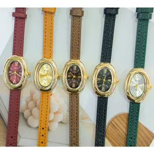 Detail view of exquisite oval quartz watches featuring slim leather straps in colors.