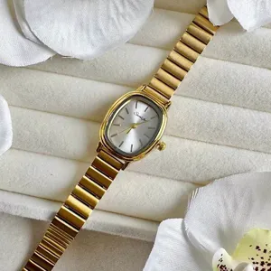 Goldene ovale Damen Quarzuhr mit Metall Armband, elegante kleine Armbanduhr fur Damen.