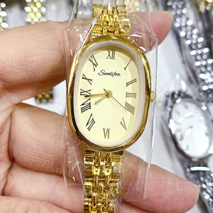 Montre quartz femme ton or cadran ovale chiffres romains bracelet acier style élégant mode.