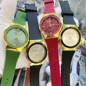 Minimalist quartz watch with silicone strap, stylish round dial daily fashion wristwatch.