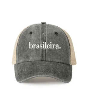 Close-up of the front embroidery detail on the vintage washed trucker hat with breathable mesh.