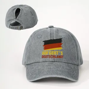 Graue Washed-Denim Baseballcap mit Pferdeschwanzöffnung und deutschem Flaggen-Detail.