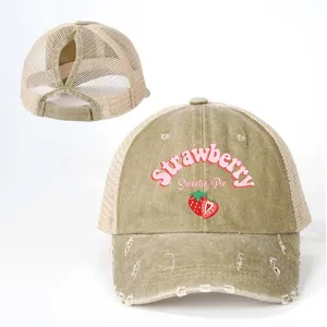 Distressed khaki mesh ponytail baseball cap with sweet strawberry embroidery and back slot.