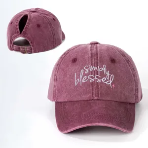 Vintage washed cotton ponytail baseball cap with stylish embroidered text and adjustable buckle.